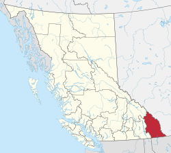 A map of British Columbia depicting its 29 regional districts and equivalent municipalities. One is highlighted in red.